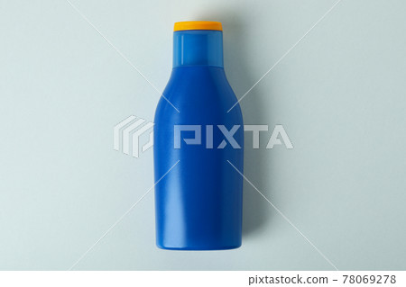 Blank blue bottle of sunscreen on white background Blank blue bottle of sunscreen on white background 78069278
