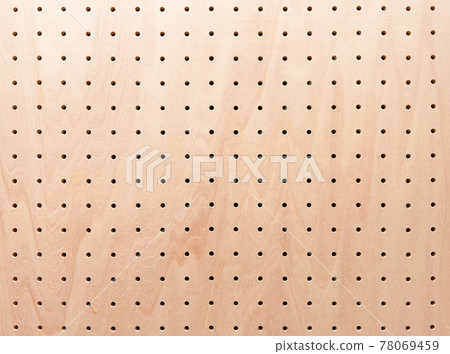 Background image of a light reddish brown perforated board with wood grain 78069459