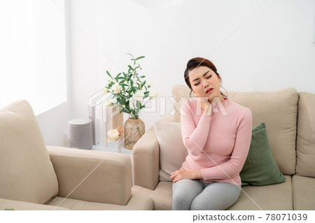 Beautiful woman is having pain in her neck.Neck pain 78071039