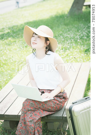 A young woman worcation in the fresh green 78074953