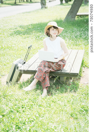 A young woman worcation in the fresh green 78074980