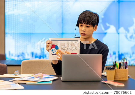 A scene of teleworking in a casual office with a large screen 78076661
