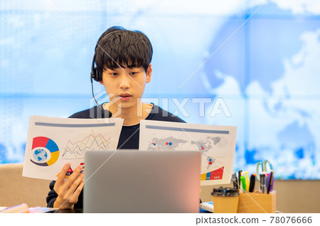 A scene of teleworking in a casual office with a large screen A scene of teleworking in a casual office with a large screen 78076666