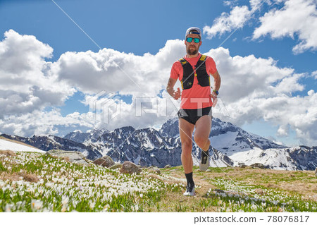 Strong Trail Running athlete in the mountains in training 78076817