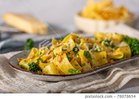 Garlic pasta with chilli flakes 78078654