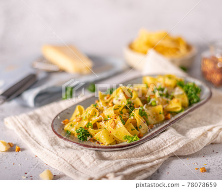 Garlic pasta with chilli flakes 78078659
