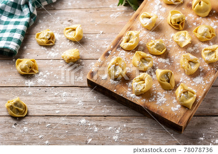 Uncooked pelmeni dumplings Uncooked pelmeni dumplings 78078736