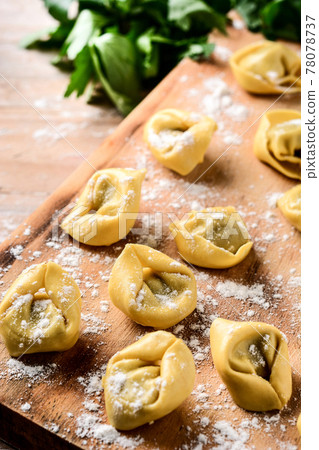 Uncooked pelmeni dumplings Uncooked pelmeni dumplings 78078737