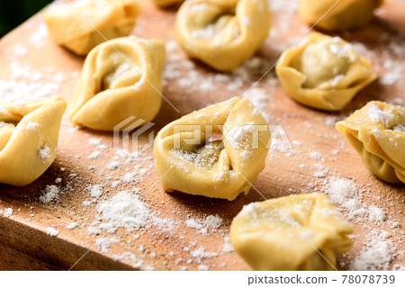 Uncooked pelmeni dumplings Uncooked pelmeni dumplings 78078739