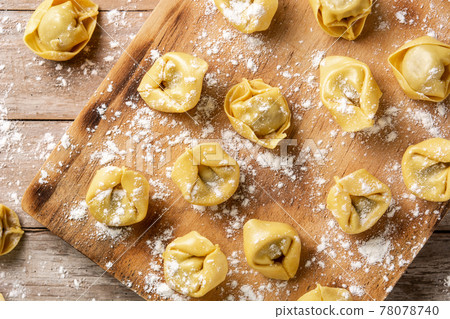 Uncooked pelmeni dumplings Uncooked pelmeni dumplings 78078740