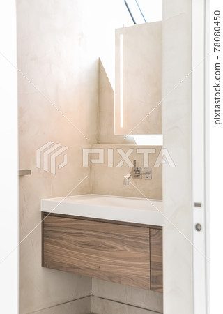Wooden cabinet with basin in bathroom Wooden cabinet with basin in bathroom 78080450