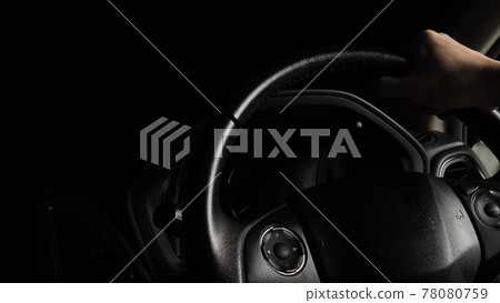 Steering wheel and man hand. Black leather modern car Interior close up. Hands on vehicle steering wheel for driving. Around steering wheel such as cruise control, horn, wiper and Automatic Gear. 78080759