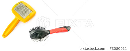 Slicker and hairbrush isolated on white. Free space for text. Wide photo. Slicker and hairbrush isolated on white. Free space for text. Wide photo. 78080911