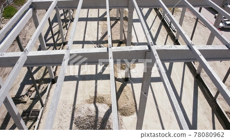 Leveling And Compaction Of Soil On The Construction Site. Modern Mini excavator Leveling The Ground With The Front Bucket On The Construction Site. Flight Over The Construction Site. 78080962