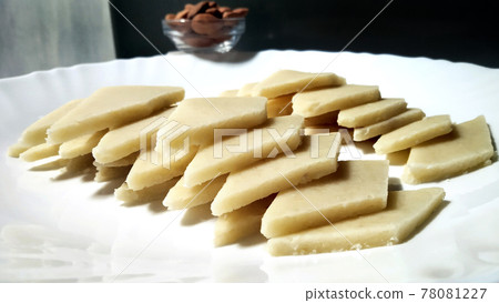 Kaju Katli is a Diamond shape Indian sweet made using cashew sugar and mava, served in a plate isolated on white background. selective focusBadam Katli is a Diamond shape Indian sweet made using Kaju Katli is a Diamond shape Indian sweet made using cashew sugar and mava, served in a plate isolated on white background. selective focusBadam Katli is a Diamond shape Indian sweet made using 78081227