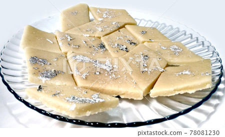 Kaju Katli is a Diamond shape Indian sweet made using cashew sugar and mava, served in a plate isolated on white background. selective focus Kaju Katli is a Diamond shape Indian sweet made using cashew sugar and mava, served in a plate isolated on white background. selective focus 78081230