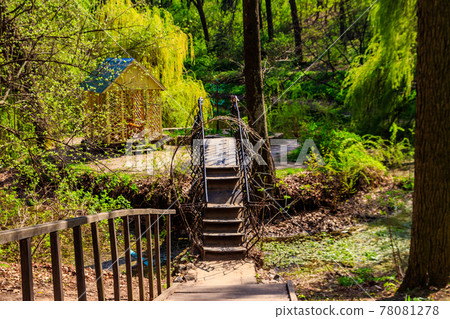 Small forged iron bridge in the Krasnokutsk park, Kharkiv region, Ukraine Small forged iron bridge in the Krasnokutsk park, Kharkiv region, Ukraine 78081278