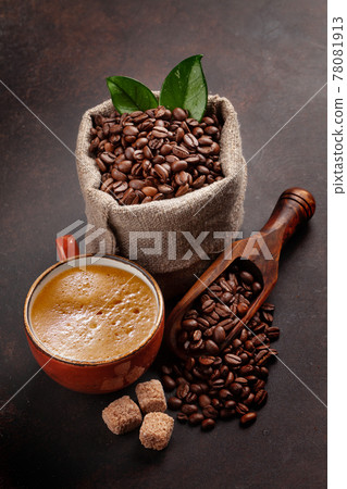 Roasted coffee beans, brown sugar and espresso cup Roasted coffee beans, brown sugar and espresso cup 78081913