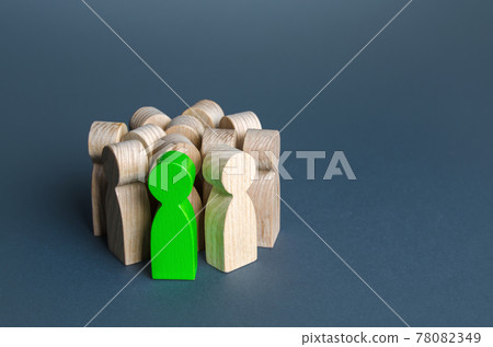 A green man stands in a crowd of people. Recruiting a talented candidate. Search for a person. Promising. Different from others. Be special. Valuable employee. Promotion at work, career growth 78082349