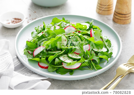 Fresh vegetarian vegetable salad with radish, cucumber and arugula, healthy food. Fresh vegetarian vegetable salad with radish, cucumber and arugula, healthy food. 78082828