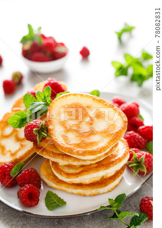 Breakfast pancakes with fresh raspberry Breakfast pancakes with fresh raspberry 78082831