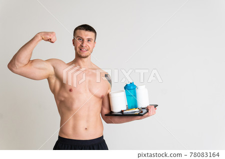 Fitness protein jars white on white background bodybuilder powder strong high ache painful, person isolated massage medicine, muscular holding. Tension red problem suffer attractive Fitness protein jars white on white background bodybuilder powder strong high ache painful, person isolated massage medicine, muscular holding. Tension red problem suffer attractive 78083164