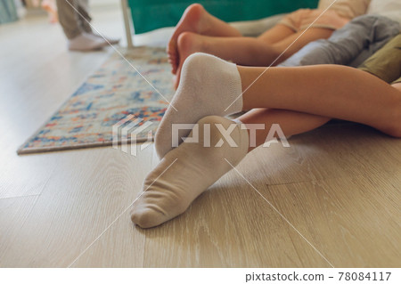 female hand close-up. dirty white socks short supply. female hand close-up. dirty white socks short supply. 78084117