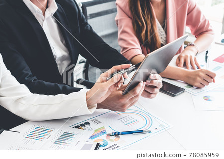 Businessman and businesswomen working in office. 78085959
