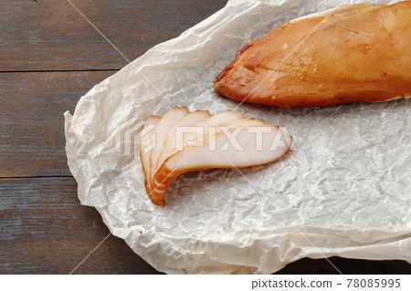Smoked chicken breast on brown wooden board Smoked chicken breast on brown wooden board 78085995