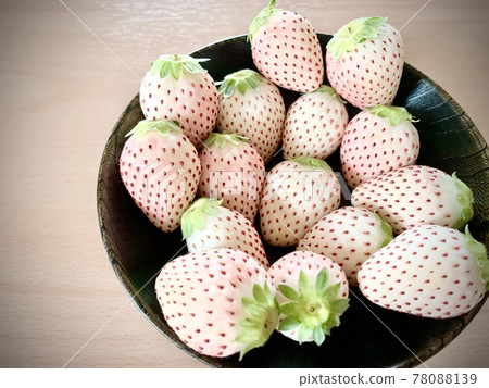 White strawberries on a black plate photo material 78088139