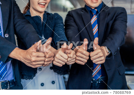 Many happy business people do thumps up sign. Many happy business people do thumps up sign. 78088769