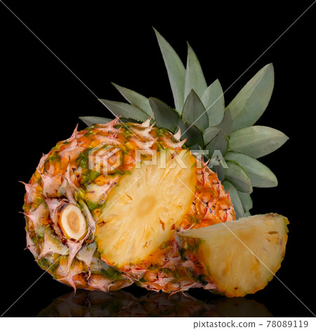 Whole pineapple and cut in half isolated on black background. Picture of tropical fruit  78089119