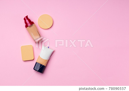 Make up foundation pack on pink background Make up foundation pack on pink background 78090337