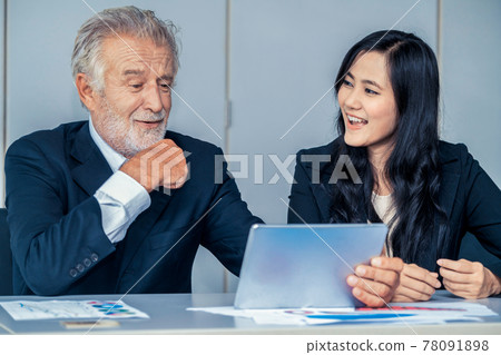 Senior executive manager and young businesswoman. Senior executive manager and young businesswoman. 78091898