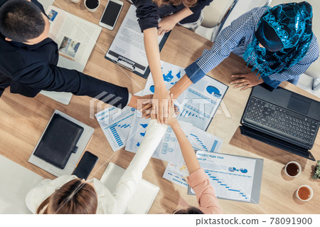 Teamwork business people join hands in meeting. Teamwork business people join hands in meeting. 78091900