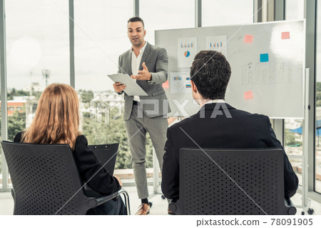 Businesswomen and businessmen in group meeting. Businesswomen and businessmen in group meeting. 78091905