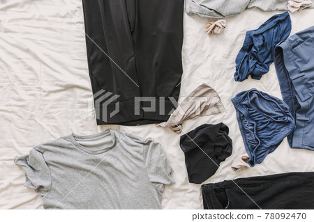 Clothes on the bed. Concept of housework and clean up clothes. Clothes on the bed. Concept of housework and clean up clothes. 78092470