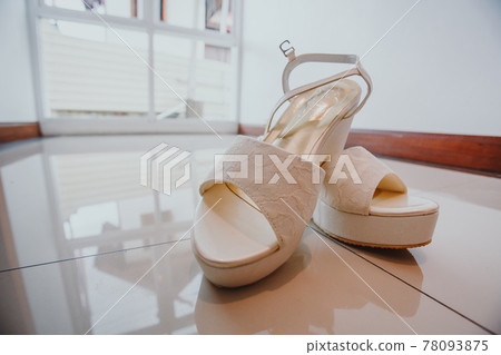 wedding concept. bride's shoes and veil 78093875