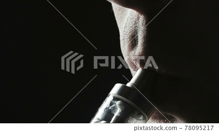 Closeup photo of smoker man on black Closeup photo of smoker man on black 78095217