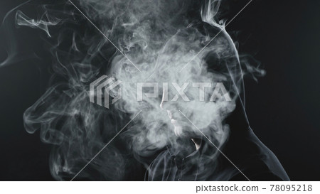 Man in black hood with the smoke inside Man in black hood with the smoke inside 78095218