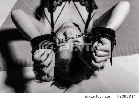sexy lingerie with handcuffs Beautiful Young Redhead Woman in Blue Lace Lingerie. Stock Image main image 0