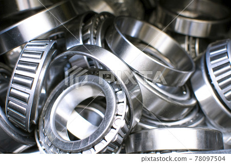 Ball bearings. Industrial steel spare parts close up background. Machinery, engine mechanism, engineering concept Ball bearings. Industrial steel spare parts close up background. Machinery, engine mechanism, engineering concept 78097504