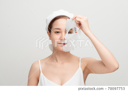 Bubbling mask on the face of beautiful woman. Skin care mask. 78097753