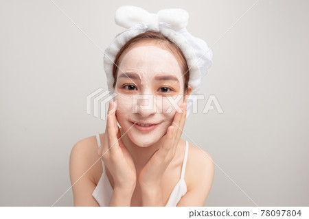 emotional funny girl is looking at the mirror. close up photo. studio shot. grey background emotional funny girl is looking at the mirror. close up photo. studio shot. grey background 78097804