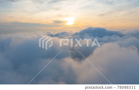 Aerial view of sunrise above fluffy sea fog misty clouds with mountain hill from Phu Tub Berk, Khao Kho, Phetchabun with sunlight. Abstract nature landscape background in morning. Aerial view of sunrise above fluffy sea fog misty clouds with mountain hill from Phu Tub Berk, Khao Kho, Phetchabun with sunlight. Abstract nature landscape background in morning. 78098311