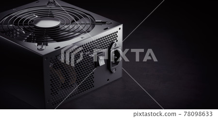 Computer AC power supply unit on black background. Computer AC power supply unit on black background. 78098633