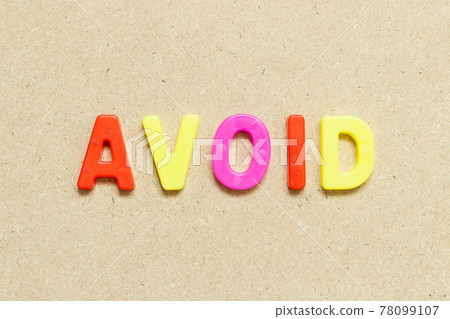Color alphabet letter with word avoid on wood background 78099107