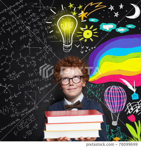 Child boy 9 years old looking at lightbulb, science and arts scetch background. Brainstorming Child boy 9 years old looking at lightbulb, science and arts scetch background. Brainstorming 78099699