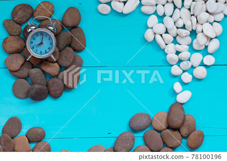 Summer concept : Seashells and pebble with alarm clock on wood background. Summer concept : Seashells and pebble with alarm clock on wood background. 78100196
