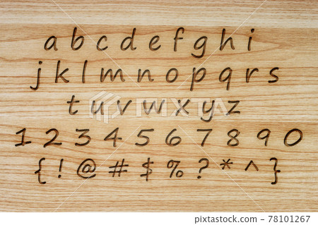 alphabet and punctuation on wood texture background. alphabet and punctuation on wood texture background. 78101267